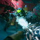 a dwarf shoots a bunch of a giant space ants with an ice gun from a first person perspective in deep rock galactic for xbox game pass